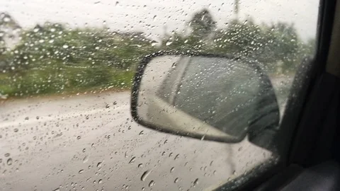 Car ride through rain Stock Footage 100808577