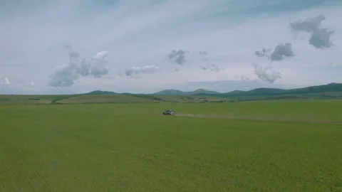 The car rides among the fields Stock Footage 245007759