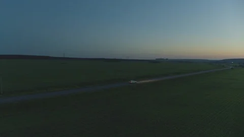 The car rides at dawn on the road Stock Footage 93849253
