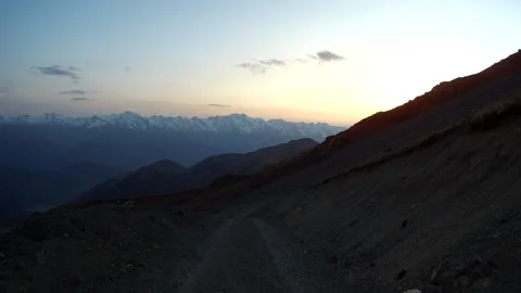 Car rides in the mountains at sunset Stock Footage 161859131