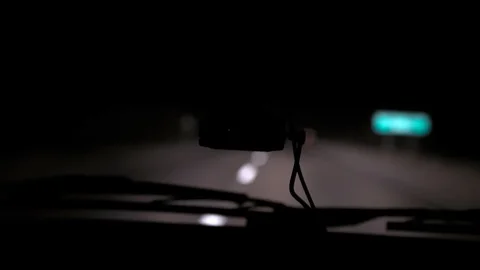 Car rides on the night road. Inside view. Dashboard, radio, DVR. Overtaking. Stock Footage 100844013