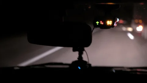Car rides on the night road. Inside view. Dashboard, radio, DVR. Overtaking. Stock Footage 100844037