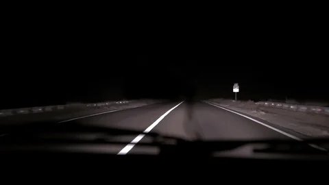 Car rides on the night road. Inside view. Dashboard, radio, DVR. Overtaking. Stock Footage 100844047
