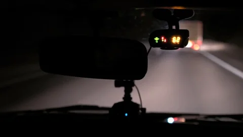 Car rides on the night road. Inside view. Dashboard, radio, DVR. Overtaking. Stock Footage 100844085