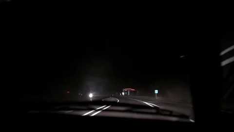 Car rides on the night road. Inside view. Dashboard, radio, DVR. Overtaking. Stock Footage 100844096