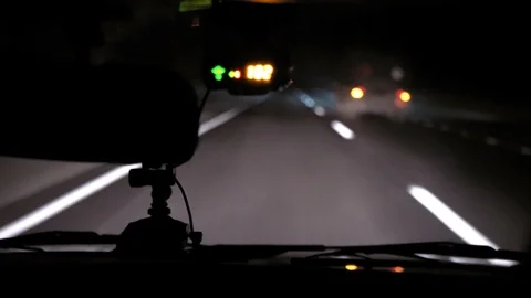 Car rides on the night road. Inside view. Dashboard, radio, DVR. Overtaking. Stock Footage 100844196