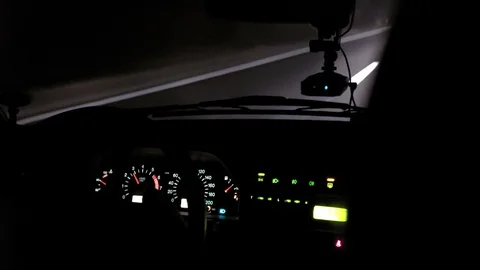 Car rides on the night road. Inside view. Dashboard, radio, DVR. Overtaking. Stock Footage 100844647