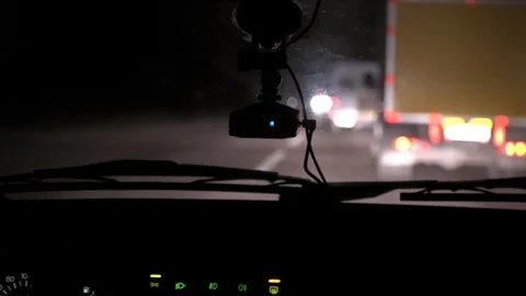 Car rides on the night road. Inside view. Dashboard, radio, DVR. Overtaking. Stock Footage 100844684