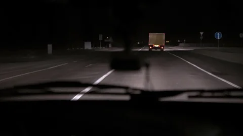 Car rides on the night road. Inside view. Dashboard, radio, DVR. Overtaking. Stock Footage 100844775