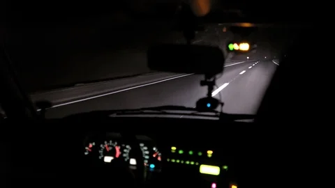 Car rides on the night road. Inside view. Dashboard, radio, DVR. Overtaking. Stock Footage 100844777