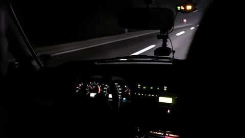 Car rides on the night road. Inside view. Dashboard, radio, DVR. Overtaking. Stock Footage 100844798