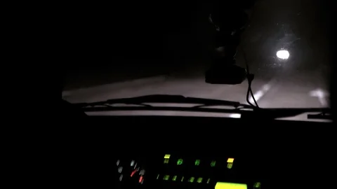 Car rides at night on a very bad road. The car cracks and staggers. Inside view. Stock Footage 100843883