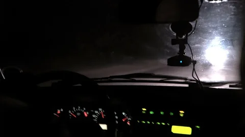 Car rides at night on a very bad road. The car cracks and staggers. Inside view. Stock Footage 100843929