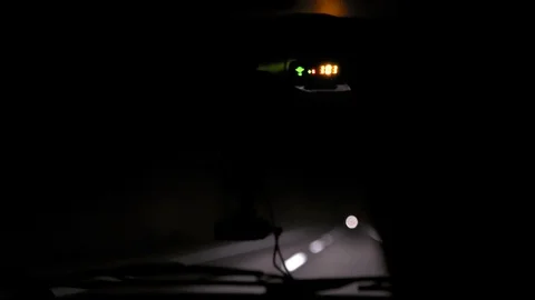 Car rides at night on a very bad road. The car cracks and staggers. Inside view. Stock Footage 100844105