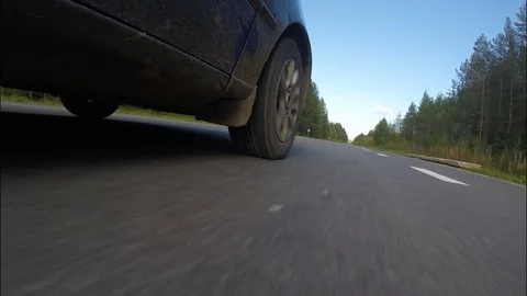 The car rides on paved road in the forest. Stock Footage 70153145
