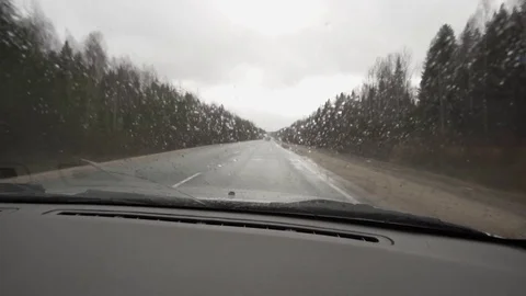 Car rides in the rain on the way Stock Footage 71274397