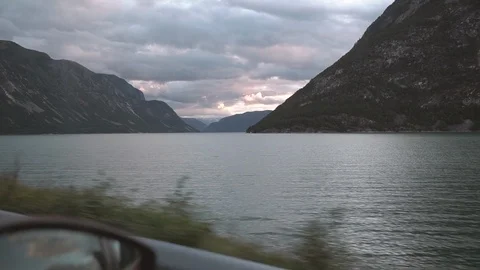 Car rides on the road, a view of the side rearview mirror, reflection in the Stock Footage 102404100
