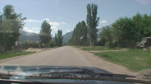 The car rides on the road. The view through the windshield Vídeos de archivo 71291368