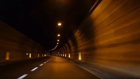 The car rides through the tunnel 動画素材 79884693