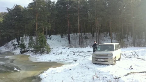 Car rides on a winter forest road on a sunny day Video stock 119908441