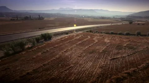 Car on a road between fields Stock Footage 9026267