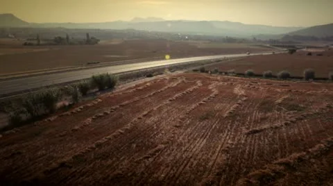 Car on a road between fields Stock Footage 9026353