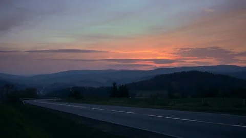 Car on the road between hills. Stock-Footage 98743883