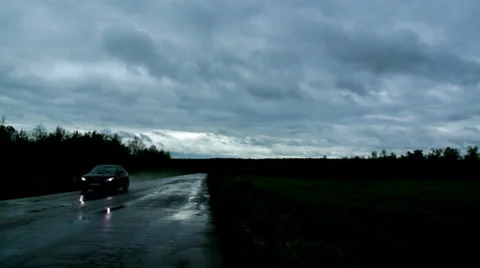 Car on road In Rain At Night Stock Footage 39829323