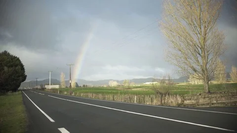Car on Road With Rainbow Video stock 79052916