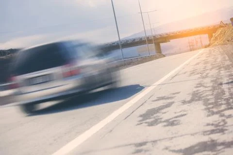 Car in road in sunset Stock Photos