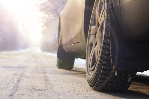 Car on the road in winter dark elements of car in the winter with hoar fro... 写真素材