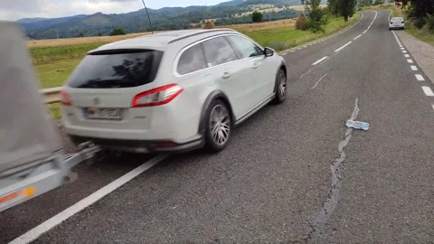 A car rolls seemingly up the hill without engine and reach 15 km/h Stock Footage 246878793