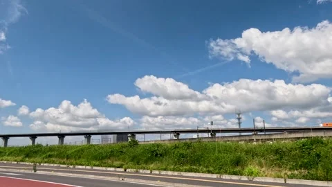 A car running on a blue sky and a bridge Stock Footage 244221811