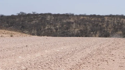 Car running in namibia streets, dry landscape, Africa 4K desert trip, blue sky Stock Footage 90912846