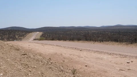 Car running in namibia streets, wild dry landscape, Africa 4K desert, blue sky Stock Footage 90912641