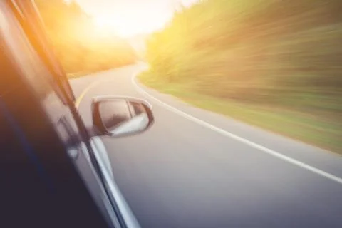 Car is running on the road, looking from inside the car in the morning. Stock Photos