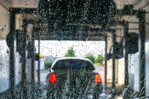 A car Running through automatic car wash... Stock Photos