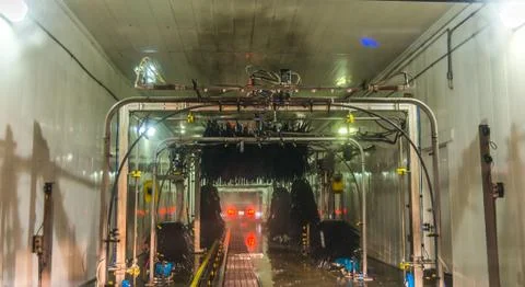 A car Running through automatic car wash. Stock Photos