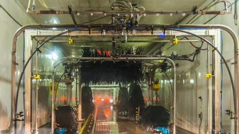 A car Running through automatic car wash. Stock Photos