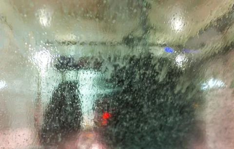 A car Running through automatic car wash. Stock Photos