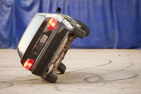 Car Running On Two Wheels Stock-Fotos