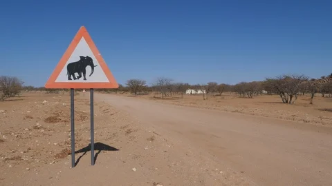 Car runs on Namibia streets, Attention Elephants sign, Africa in 4K Stock Footage 90932457