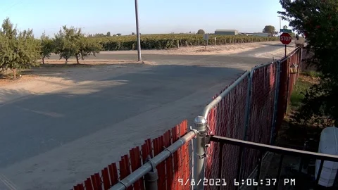 Car Runs Through Stop Sign, Crashes and Leaves, Kerman, California, USA - 08 Sep Stock Footage 205389727