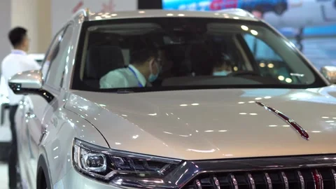 Car salesmen explain to customers Stock Footage 155606758
