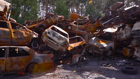 A car scrap yard is filled with abandoned vehicles and rusted metal Stock Footage 276593331