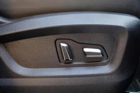 Car seat electronic switch button. lever for electronic seat adjustment in a Stock Photos