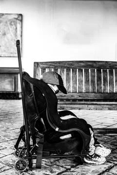 A car seat modified to be pulled by wheels with a travel cart. Stock Photos