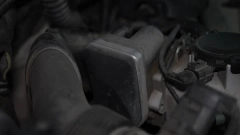 Car secondary air injection pump valve installed in engine bay. Stock Footage 344595749