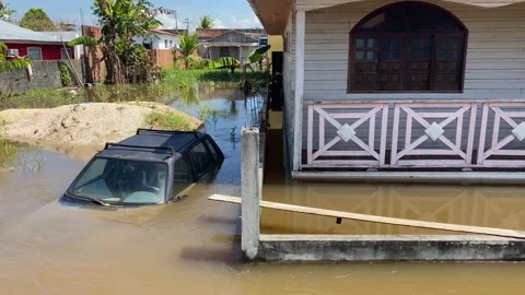 A car is seen parked amid a record level flood in Amazon rivers, Brazil, 4K Stock Footage 155029121