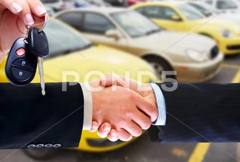 Car seller and client handshake. Stock Photos